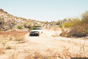 toyota-truck-driving-through-the-desert