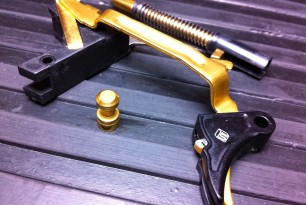 Image shown features SAI's special-edition Titanium Nitride coated trigger group.