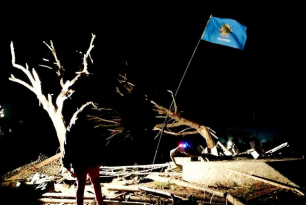 Oklahoma flag amidst the rubble of Moore OK Oklahoma flag amidst the rubble of Moore OK