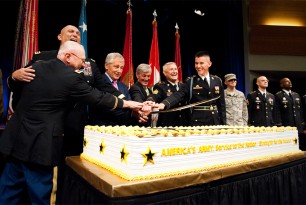 Col. Wittich and General Andrew and PFC Segla cut the Army's birthday cake Col. Wittich and General Andrew and PFC Segla cut the Army's birthday cake