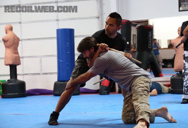 Kali master and former SWAT officer Jared Wihongi stops Jason Jones' takedown attempt while simultaneously controlling his neck. 