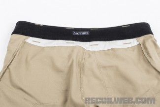 The fleece lining helps reduce friction and the white fabric is reinforcement for the belt loop stitching.