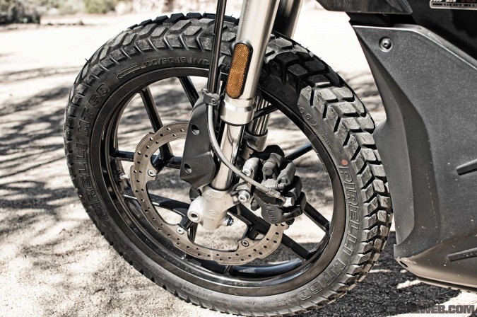 Front binders are J-Juan aysmetric two-pot calipers tied to a Bosch Gen 9 ABS system. Despite the 450-pound curb weight of the DS plus its extra battery pack, they had no problem stopping it.