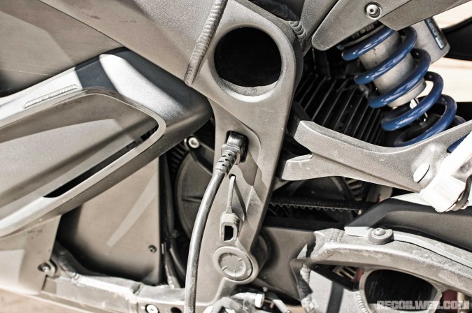 Showa 41mm rear shock is adjustable for rebound, compression, and preload. Charger cord plugs into the frame.