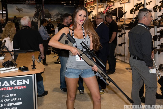 Kasandra at Cadex-booth holding the CDX-R7 Sheepdog rifle