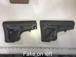 Spring and hinge pin is not stainless on fake. Finish on interior of compartment is glossy vs real UBR.