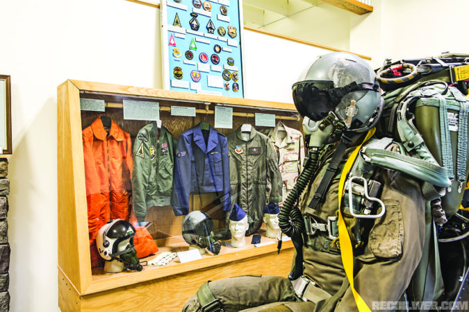 Center left: Various Air Force uniforms can be found at the museum as well as this F4 ejection seat.