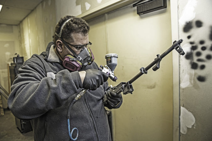 Rodney Backus, with the Park City Gun Club, Cerakotes the barrel of our AKM. PCG’s fledgling Cerakote operation might be low volume, but it’s high quality.