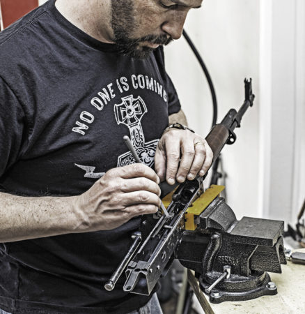 Filing the ejector in the Childress AKM receiver. It’s part of the welded-in guide rail, and it’s usually left long and needs to be filed down to allow the bolt to pass over it.