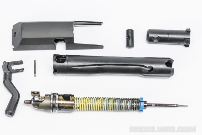 The bolt carrier assembly can be taken apart with a punch and the bolt head swapped for different calibers.