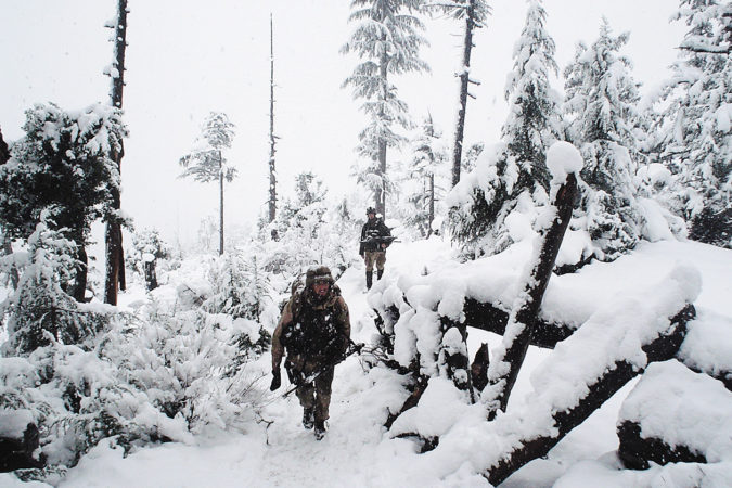 U.S. Army Rangers secure the high ground above a natural choke point between three valleys that could be used for fleeing insurgents during Operation Winter Strike in 2003.