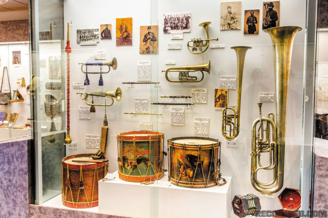 Musical instruments belonging to the Federal Army Military Bands. Pictured are drums, bugles, Jew harp, bones, fifes, flute, coronets, saxhorns, and a concertina. 