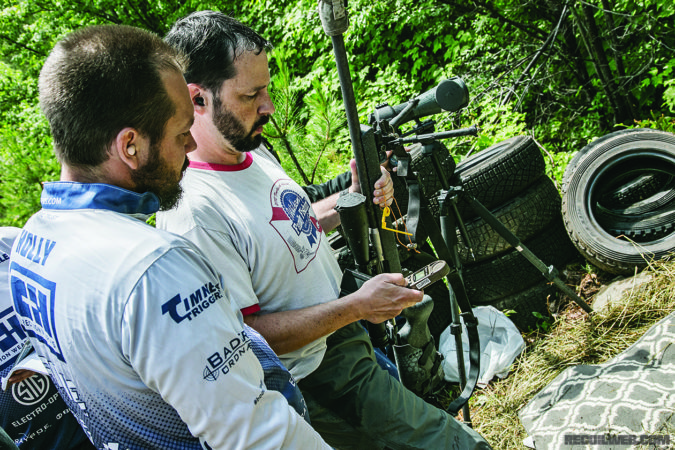 Buck Holly, left, helps the author diagnose an issue with his ballistic data. As the tools for long range shooting become more advanced, they also become more complicated.