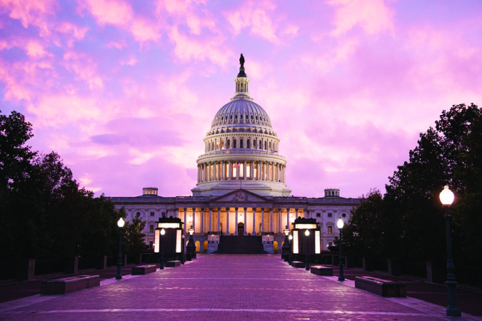 Washington DC: The sun sets on the United States Capitol building.