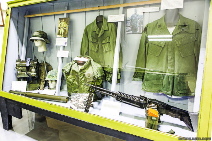 Displays of Vietnam War items like these uniforms and M60 can also be seen at the museum. 