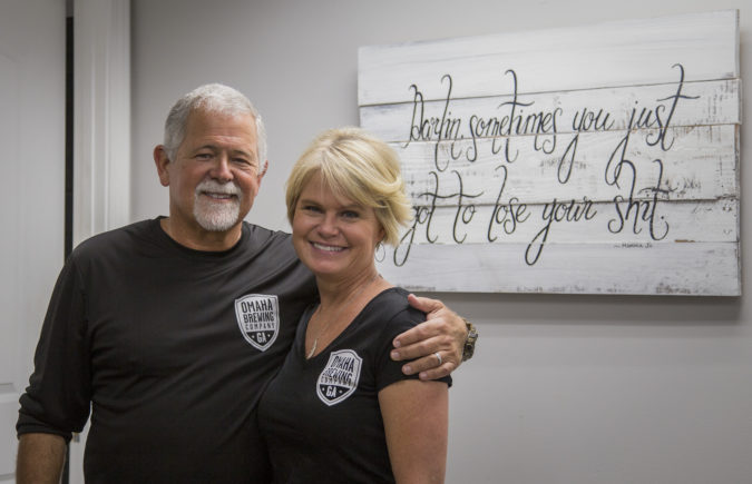 Doc and his wife, Stephanie, in front of an all too honest quote, "Darlin, sometimes you just got to lose your shit."