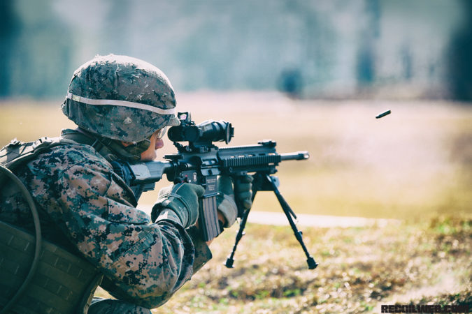 Lance Cpl. Jose Damoeda, rifleman, Company A, Ground Combat Element Integrated Task Force, fires an M27 Infantry Automatic Rifle during a fire team collective skills exercise at Range K509, Marine Corps Base Camp Lejeune, North Carolina, Dec. 16, 2014. The assault served as the companyâs first collective skills-level exercise. From October 2014 to July 2015, the Ground Combat Element Integrated Task Force will conduct individual and collective skills training in designated combat arms occupational specialties in order to facilitate the standards based assessment of the physical performance of Marines in a simulated operating environment performing specific ground combat arms tasks. (U.S. Marine Corps photo by Cpl. Paul S. Martinez/Released)