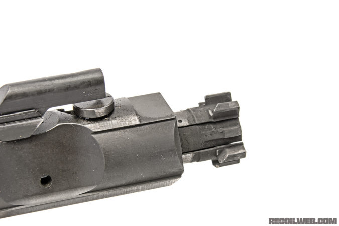 Unlike many designs, on this one the last round hold open feature works reliably — note the long lever running along the left side of magwell. Chamfered lugs mean the bolt doesn’t really lock, but sucks up recoil force to operate. 