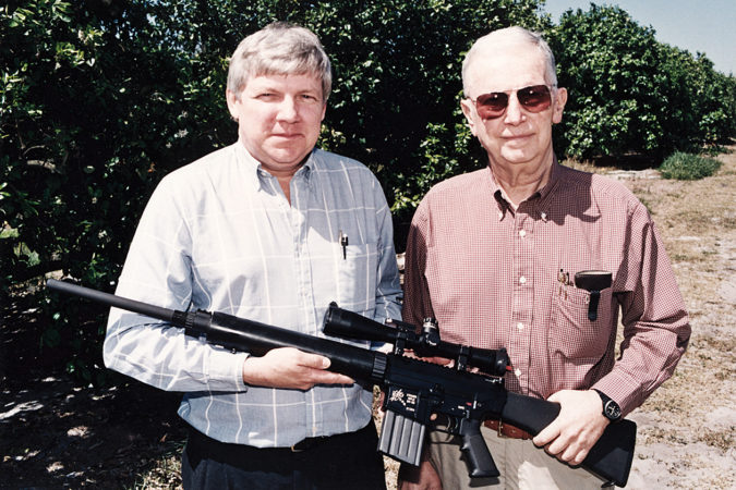 In front of the citrus orchards at the old Knight’s facility in Vero Beach, Knight with Gene Stoner and an early SR-25 7.62x51mm caliber rifle.