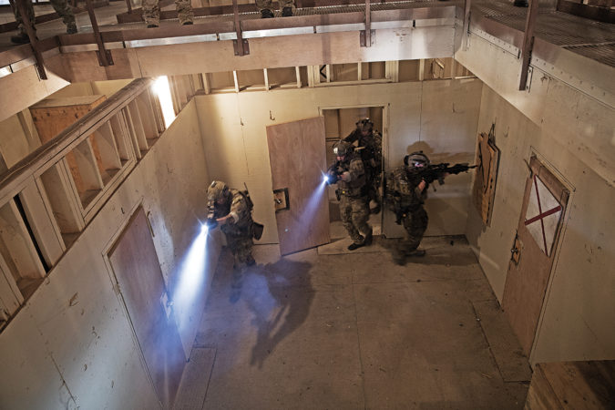 CQB is a team sport. This SOF team made use of all their tools, from weapon-mounted lights to explosive breaching charges.