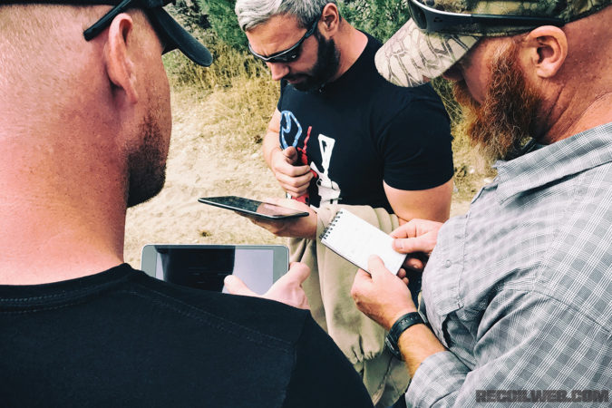 The owner and lead instructor of Team TORN walks the author through route planning prior to an off-road movement exercise.