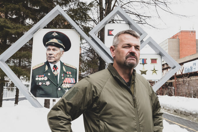 At IZHMASH in Izhevsk, in front of a sign commemorating Mikhail Kalashnikov. Photo by Valery Moroz.