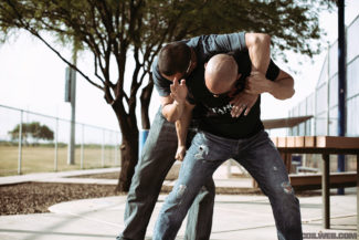 Chad sidesteps to create an opening and delivers a downward hammer strike to the attacker’s groin. 