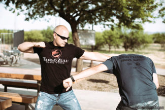 Chad uses the lead cycling hand to deliver an open palm to the face and obscure the attacker’s vision.