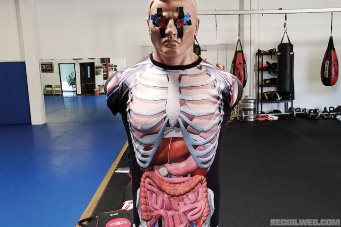 The Body Opponent Bag is one of the most useful combatives training tools. Shown here with the Dionisio Zapatero anatomical rash guard for vital target identification.