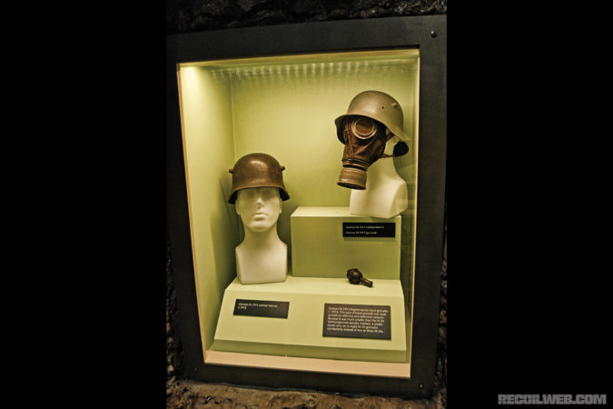 A pair of captured German “stahlhelms” (steel helmets) and a rare German gas mask are on display with an early “egg style” hand grenade. All of these items were donated to the museum.