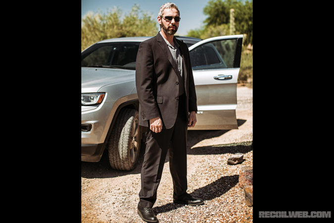 The Suit Man tactical suit is comfortable and lightweight, while also aiding concealment. The author is wearing his Glock 19, two spare mags and ankle med kit in this photo.