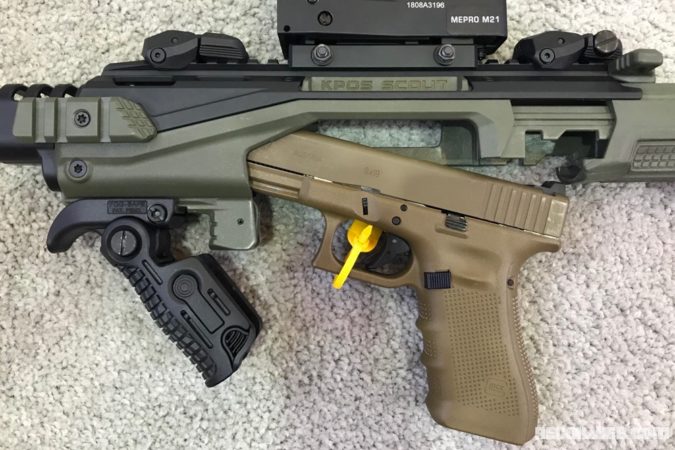 Inserting the Glock into the housing of the Kypos Scout SL