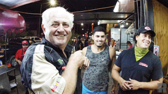 After a long day, Dan Cornwell, Manny Alvarez, and Angel Tegardine grab a quick street dog for dinner.