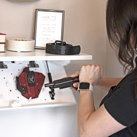 Home-defense training, retreving a gun from a hidden gun safe.