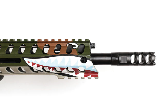 The handguard sports the iconic WWII Flying Tiger’s shark mouth.