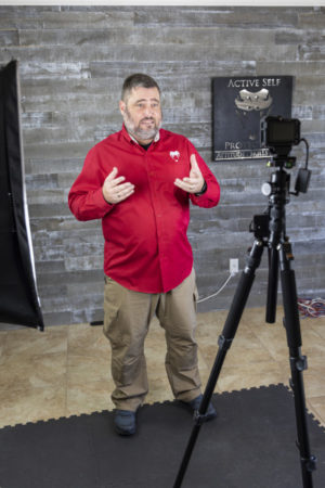 John keeps his studio setup simple, with a GoPro on a tripod and two softbox lights.