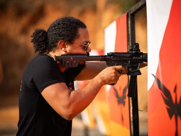 A competitor steps up to the firing line at the Proving Grounds lane.